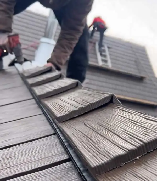 An A & G Roofing crew member on the job