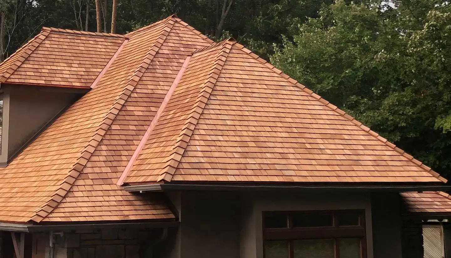 A completed cedar roof with copper valleys by A & G Roofing